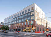 Thumbnail 40 of 78 - a building with a street in front of it