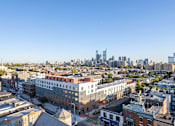 Thumbnail 75 of 78 - a view of the city from the roof of a building