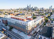 Thumbnail 4 of 78 - an aerial view of the block of apartments and the city skyline