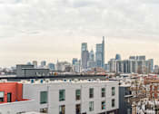 Thumbnail 71 of 78 - A cityscape with a mix of modern and older buildings.