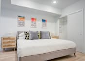 Thumbnail 50 of 78 - a bedroom with a bed and a closet