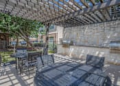 Thumbnail 31 of 39 - Pet-Friendly Apartments in Houston, TX – Westchase Forest – Photo of BBQ Grill and Picnic Tables