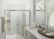 Thumbnail 16 of 31 - Roseville, CA Pet-Friendly Single Family Homes for Rent - Vera at Fiddyment - Bathroom with Standing Shower, Vanity with Quartz Countertop, and Medicine Cabinet Mirror.