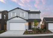 Thumbnail 24 of 31 - a home with a white garage door in front of it