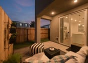 Thumbnail 31 of 31 - Three-Bedroom Single Family Homes for Rent in Roseville, CA - Vera at Fiddyment - Patio with Outdoor Furniture, Sliding Glass Door, and Privacy Fence.