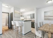 Thumbnail 5 of 18 - Nashville, TN Apartments - Parc at Metro Center - kitchen with breakfast nook and barstools and dining room
