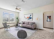 Thumbnail 6 of 33 - Apartments for Rent in Bentonville, AR 72713– Parc at Bentonville -   Living Room with ceiling fan and large windows