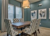 Thumbnail 27 of 33 - The Clubhouse with a table and seats at Parc at Bentonville