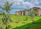 Thumbnail 25 of 33 - 1 & 2-Bedroom Apartments for Rent in Bentonville, AR – Parc at Bentonville – exterior grassy area