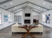 Thumbnail 4 of 18 - Nashville, TN Apartments - Parc at Metro Center - Clubhouse with vaulting ceilings and TV