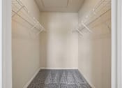 Thumbnail 8 of 25 - Empty room with white walls and grey carpet.