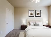 Thumbnail 11 of 25 - a bedroom with a large bed and two night stands