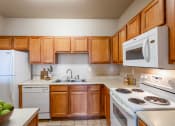 Thumbnail 1 of 25 - Clarksville, TN Apartments - Parc at Clarksville - Open concept kitchen with cabinet and storage space