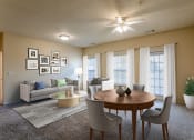Thumbnail 8 of 25 - Apartments in Clarksville, TN for Rent - Parc at Clarksville - dining room and living room area and large windows and ceiling fan