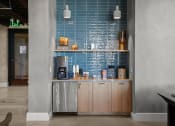 Thumbnail 16 of 43 - a kitchen with a blue tiled wall and wooden cabinets