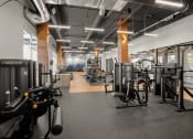 Thumbnail 19 of 43 - a gym with weights and other exercise equipment on the floor