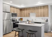 Thumbnail 8 of 43 - a kitchen with a island and two stools