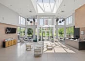 Thumbnail 23 of 38 - a living room with a large amount of windows