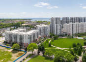 Thumbnail 33 of 38 - an aerial view of a city with tall buildings and a park