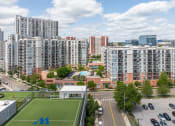 Thumbnail 34 of 38 - an aerial view of the city with a soccer field and a park