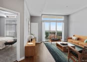 Thumbnail 8 of 38 - living area and bedroom with modern furnishings and windows