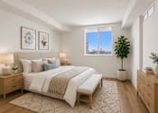 Thumbnail 6 of 31 - A bedroom with a large bed, two nightstands, and a window overlooking a cityscape.