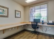 Thumbnail 10 of 26 - Apartments in Coeur d’Alene ID - Rockwood Lodge - Business Center with Desk Space, a Computer, and a Printer