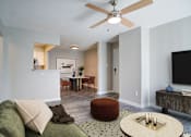 Thumbnail 5 of 19 - Rutland Place Apartments living room with view of dining area, pet-friendly apartments in Macon, GA
