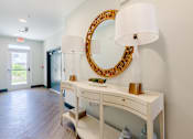 Thumbnail 17 of 22 - Welcoming resident lobby with decorative furnishings and modern design at Sage 5430 apartments.