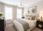 Thumbnail 7 of 22 - Spacious primary bedroom with natural light and modern finishes inside a Sage 5430 one bedroom apartment in Norcross, Georgia.