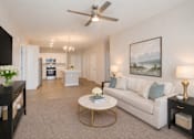 Thumbnail 6 of 22 - Beautifully staged apartment living room with modern finishes and open-concept design at Sage 5430 in Norcross near Jimmy Carter Boulevard.