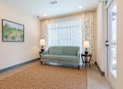Thumbnail 18 of 22 - Comfortable community sitting area with large windows inside Sage 5430 55+ apartments in Gwinnett County.