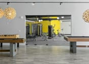 Thumbnail 14 of 18 - Apartments in Tempe, AZ for Rent – Sentry Tempe – fitness center with weights and machines