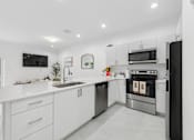 Thumbnail 1 of 20 - modern kitchen with stainless steel appliances at Pearl at Pompano Beach homes for rent in Pompano Beach FL