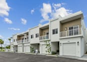 Thumbnail 2 of 20 - exterior of luxury two story townhomes with attached garages in Pompano Beach Florida homes for rent