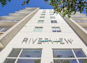 Thumbnail 26 of 27 - 1- & 2-Bedroom Apartments for Rent in Miami, FL – Riverview One Apartments – A white building with the word "RIVERVIEW" on the side.