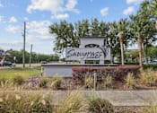 Thumbnail 20 of 28 - A sign that says Sawgrass in front of some trees.
