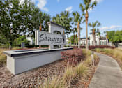 Thumbnail 1 of 28 - A sign that says SavvyGlass in front of some trees.