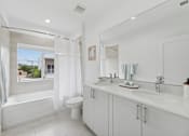 Thumbnail 9 of 20 - bathroom with double vanity in modern townhome for rent in Pompano Beach FL