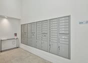 Thumbnail 22 of 27 - 1- & 2-Bedroom Apartments for Rent in Miami, FL – Riverview One Apartments – A row of mailboxes are lined up against a wall.
