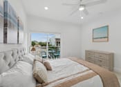 Thumbnail 8 of 20 - primary bedroom with natural light in luxury home for rent Pompano Beach Florida