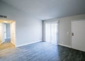 Thumbnail 24 of 31 - an empty living room with a white door
