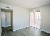 Thumbnail 22 of 31 - an empty living room with a sliding glass door
