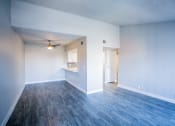 Thumbnail 23 of 31 - an empty living room with a ceiling fan