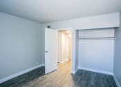 Thumbnail 27 of 31 - an empty room with a closet and a door open