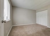 Thumbnail 7 of 15 - a bedroom with a closet and a window