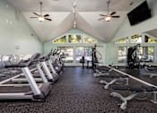 Thumbnail 3 of 14 - Fitness center with cardio equipment in Stockbridge GA apartment community at Southwinds Point
