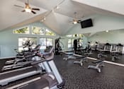 Thumbnail 11 of 14 - Apartment gym in Stockbridge GA with treadmills and strength equipment near South Atlanta