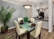 Thumbnail 7 of 14 - Dining area in Stockbridge GA apartment with open layout and modern lighting at Southwinds Point