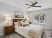 Thumbnail 6 of 18 - Spacious bedroom with large window inside a one, two and three bedroom apartment at Southwinds Point Apartments in Stockbridge, GA.
